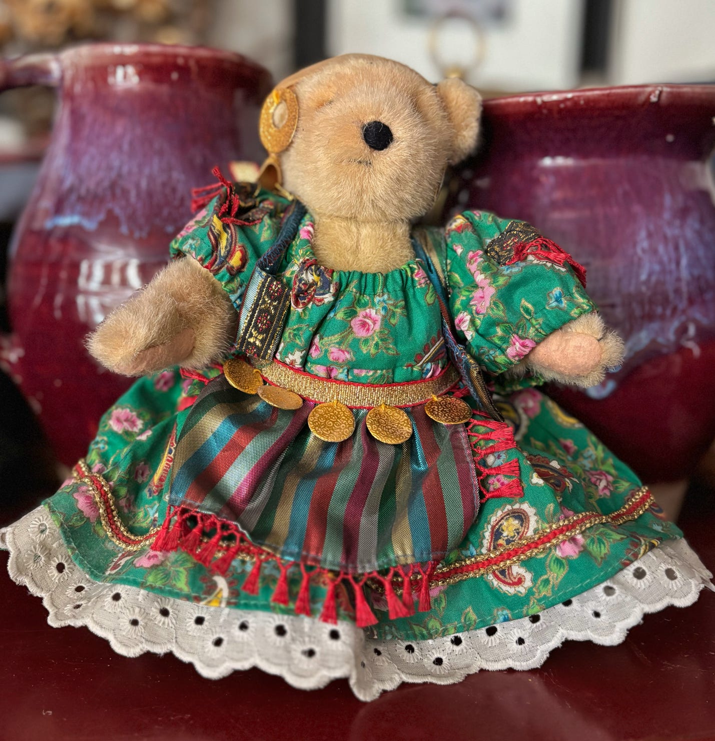 A Muffy Vanderbear in a fortuneteller green outfit