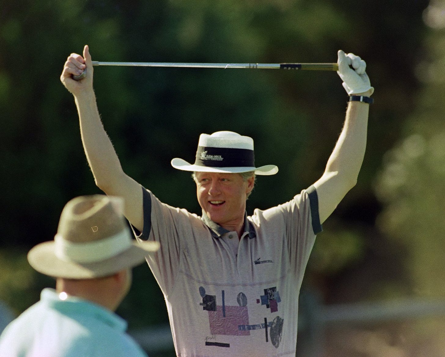 President Bill Clinton stretches before a golf tournament at Farm Neck Golf Club on Martha's Vineyard, August 22, 1993, during his family's 10-day vacation. President Bill Clinton stretches before a golf tournament at Farm Neck Golf Club on Martha's Vineyard, August 22, 1993, during his family's 10-day vacation.
