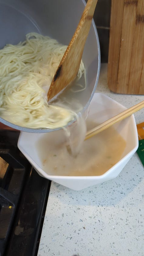 Nissin Raoh instant ramen packet being opened, noodles cooked, sauce packets mixed, and final product served in a delicious soupy bowl.