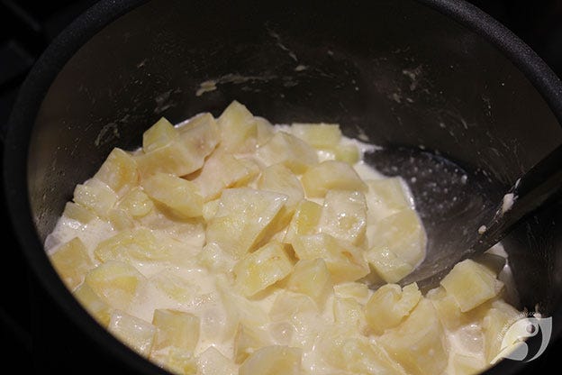 cooked parsnips with milk, cream, butter in a pan cooked parsnips with milk, cream, butter in a pan