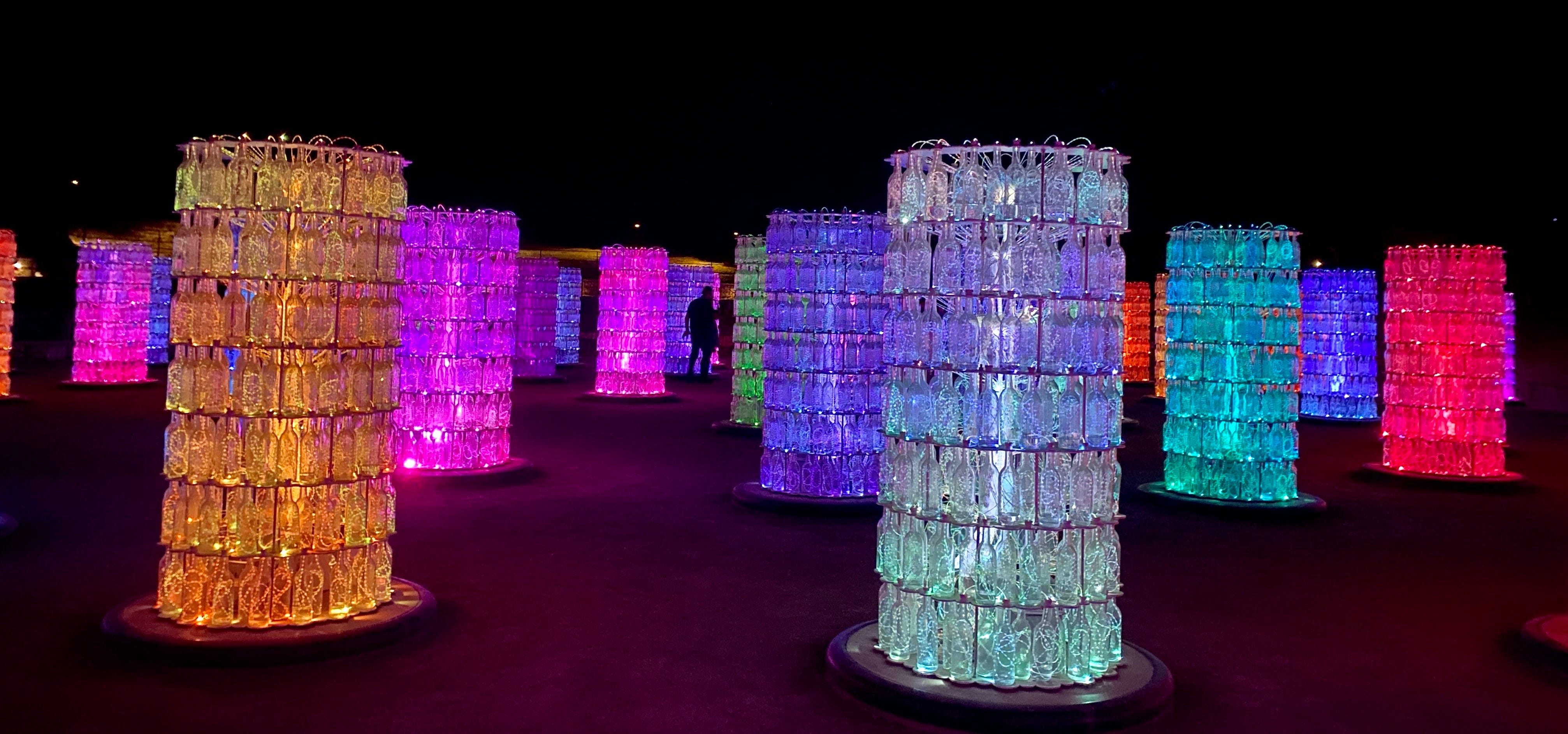 Lighted towers made of clear wine bottles in homage of the area’s wine industry. Lighted towers made of clear wine bottles in homage of the area’s wine industry.