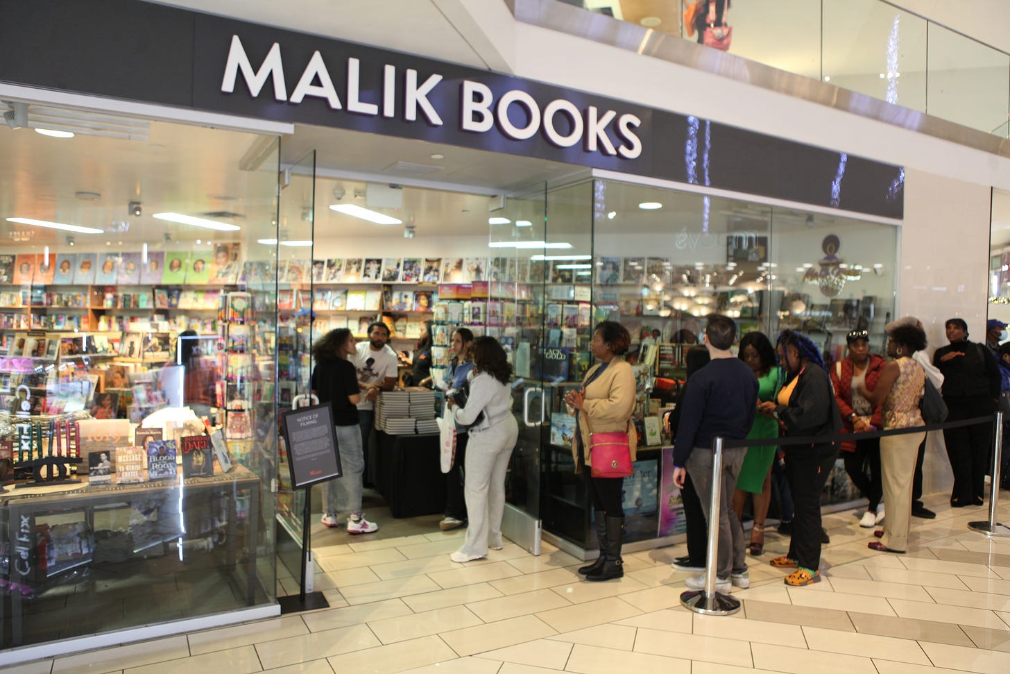 Customers gathered outside the Malik Books storefront at a Los Angeles mall Customers gathered outside the Malik Books storefront at a Los Angeles mall
