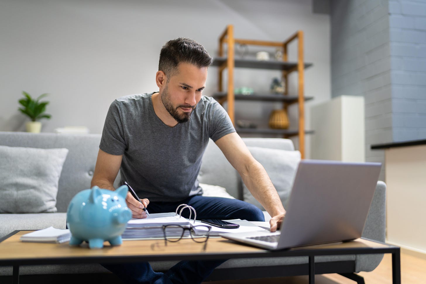 Man at home going through personal finances