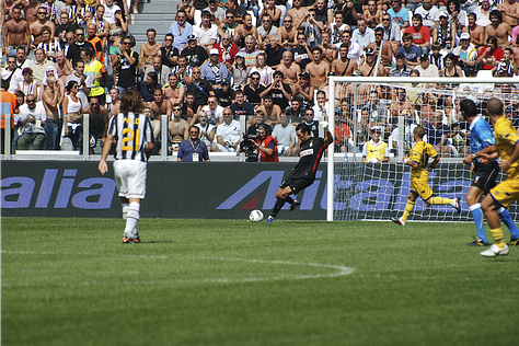 Juventus vs Parma, September 11, 2011: team huddle, player introductions, Antonio Conte coaching from the sideline, Pirlo and Del Piero in action, and Juventus players celebrating a goal during the opening match at Juventus Stadium.