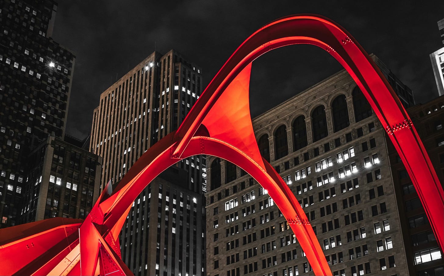 Photo of Calder's Flamingo sculpture in Chicago at night Photo of Calder's Flamingo sculpture in Chicago at night