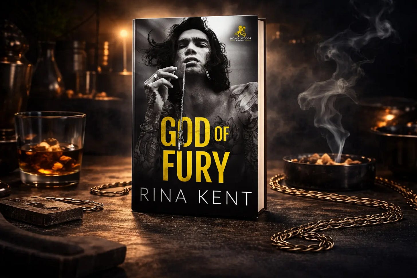 Book cover of God of Fury by Rina Kent, featuring a tattooed man holding a chain, set against a dark, moody background with candles, smoke, and a glass of whiskey.