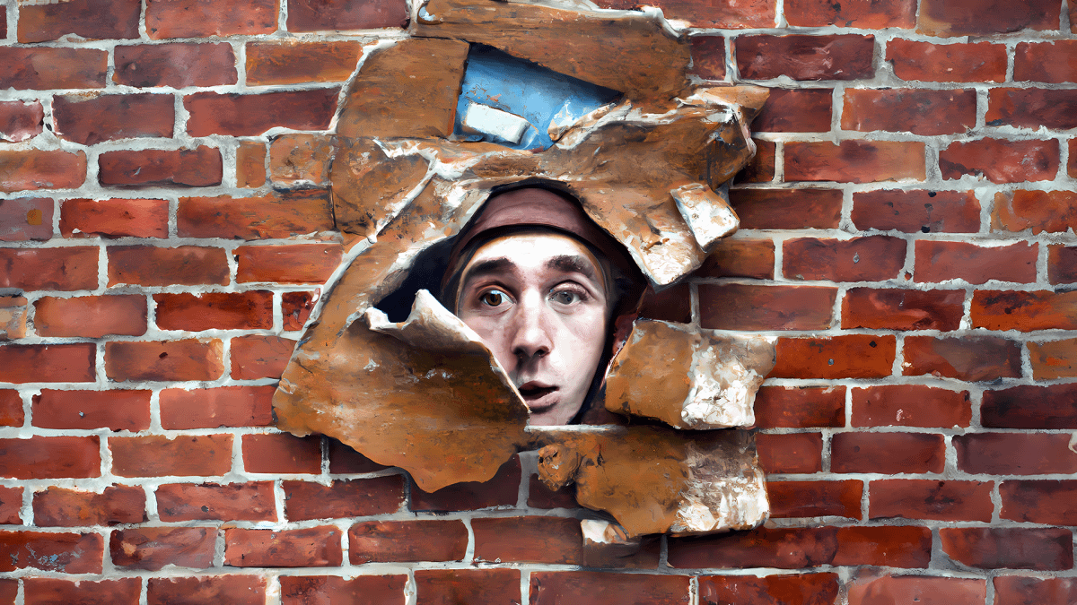 "One Less Brick in the Wall," original digital illustration by author. Young white grad student's head explodes through a brick wall. "One Less Brick in the Wall," original digital illustration by author. Young white grad student's head explodes through a brick wall.