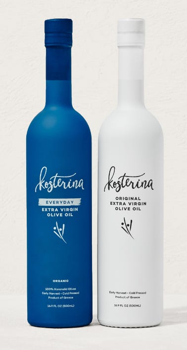 One white bottle and one blue bottle of Kosterina Extra Virgin Olive Oil