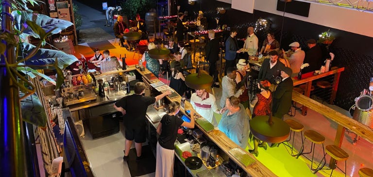 Image of people in the Redlands Coast Distillery enjoying drinks