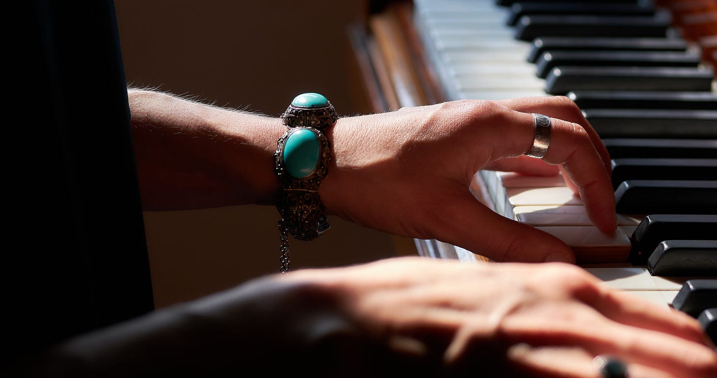 A close-up of Danielle's hands playing the piano A close-up of Danielle's hands playing the piano