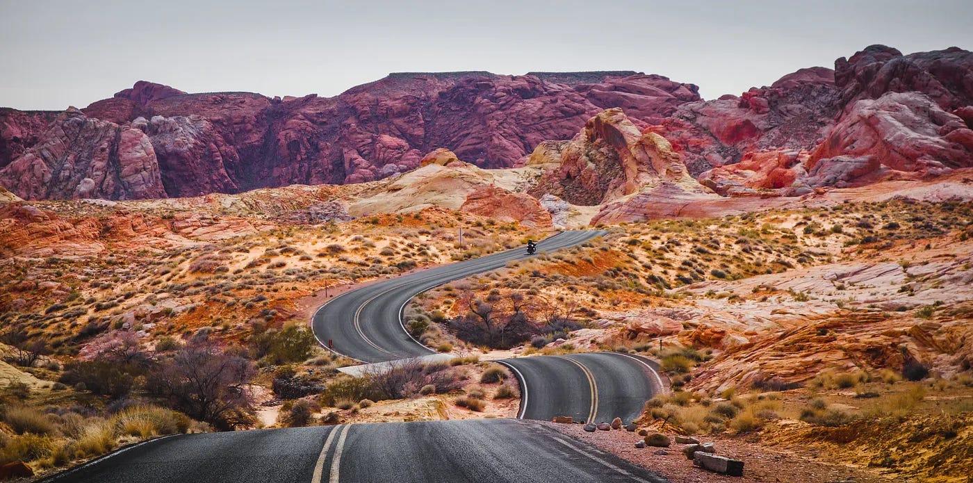 Photo of a snaking highway in the painted mountains