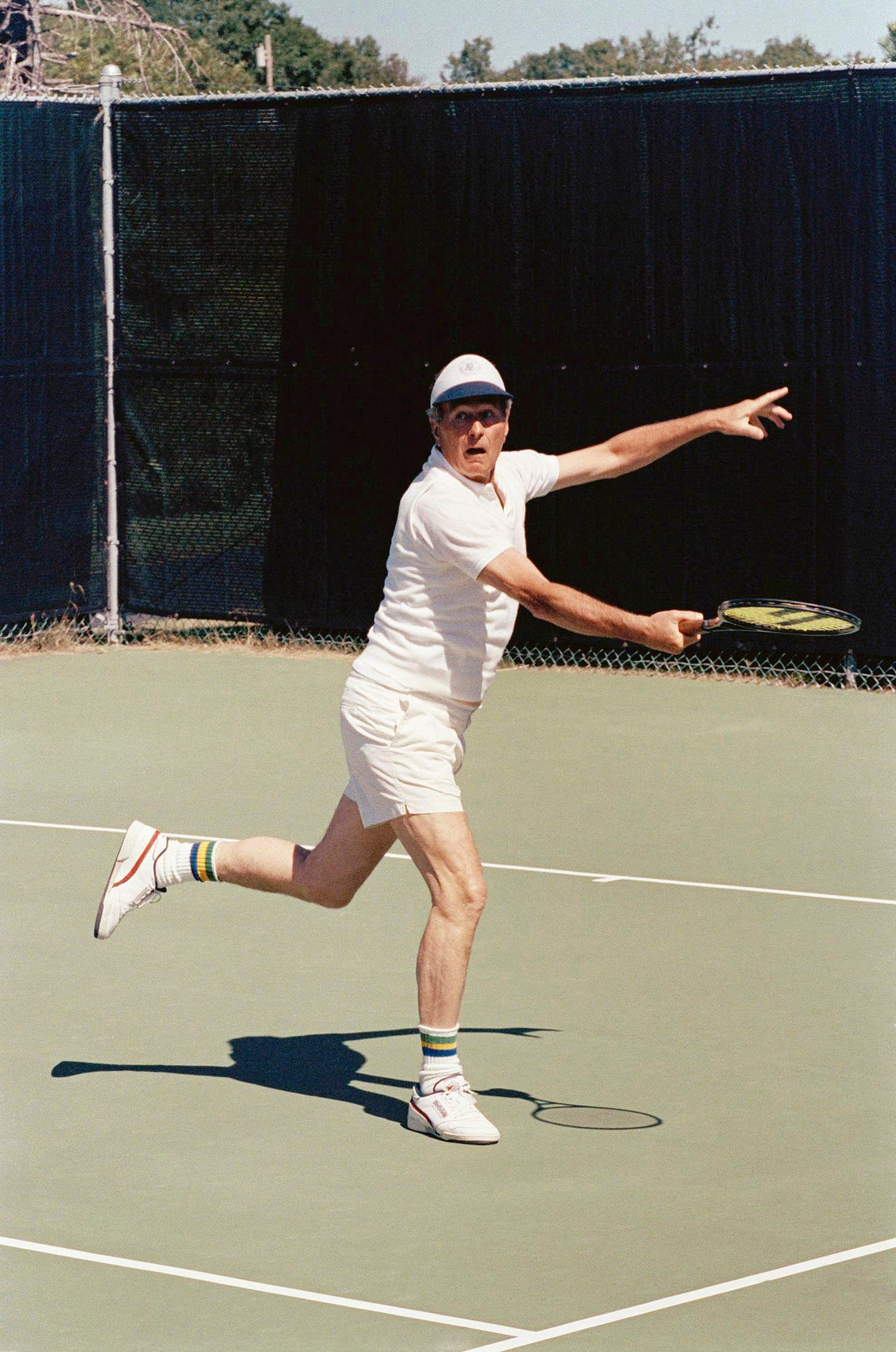 President George H.W. Bush reaches for a return shot during a doubles match with son Jeb Bush at the family compound on Walker's Point, Kennebunkport, Maine, August 27, 1989. President George H.W. Bush reaches for a return shot during a doubles match with son Jeb Bush at the family compound on Walker's Point, Kennebunkport, Maine, August 27, 1989.