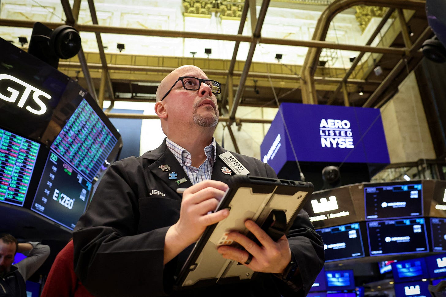 Traders work on the floor of the NYSE in New York