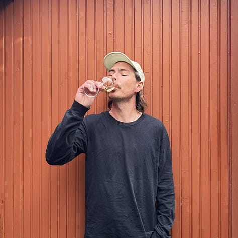 Mike Gibb drinking wine