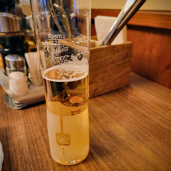 Five different photos of food and drink popular in Vienna.