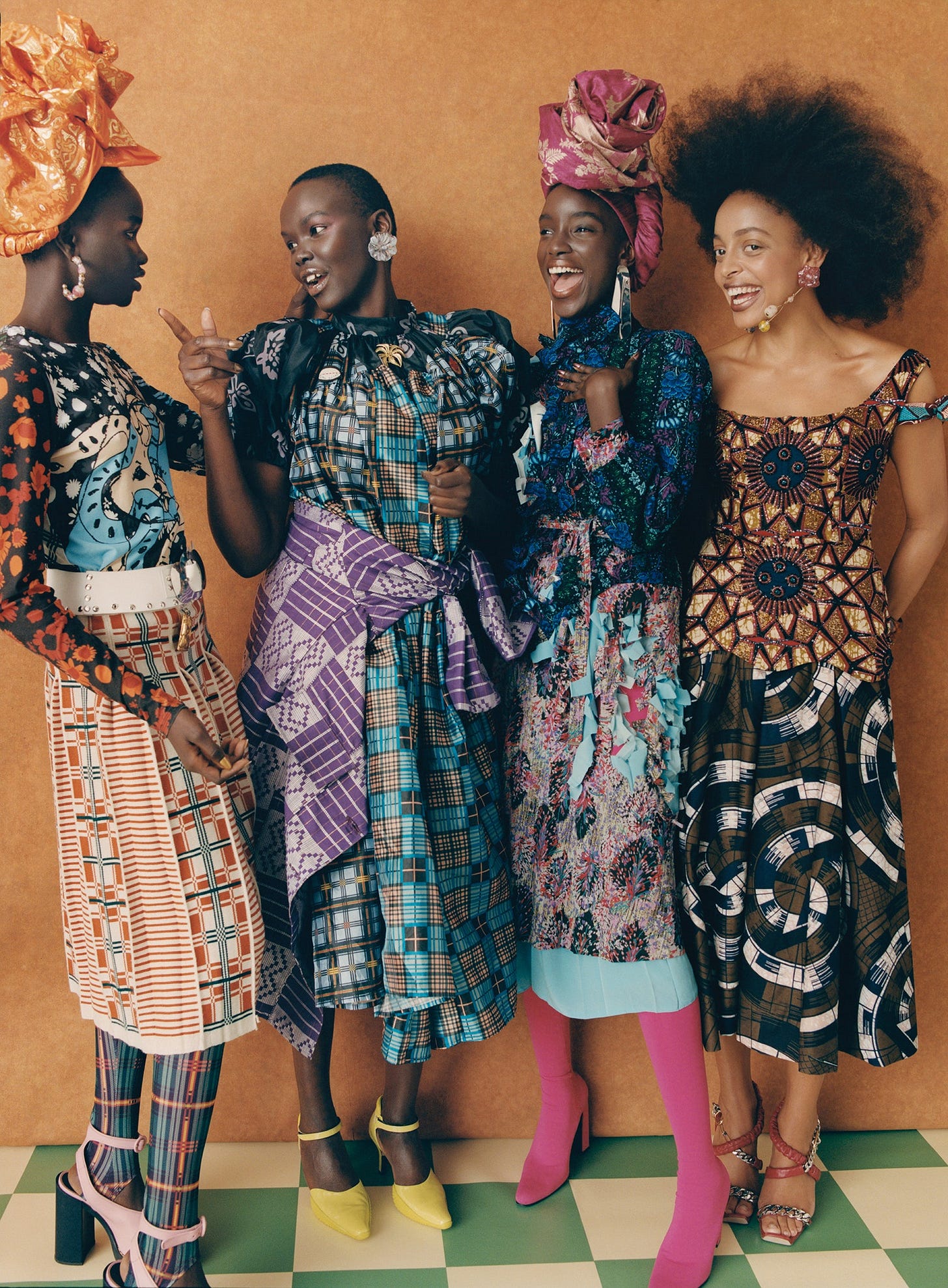 Image may contain Clothing Apparel Dress Human Person Flaviana Matata Hair Evening Dress Fashion Gown and Robe