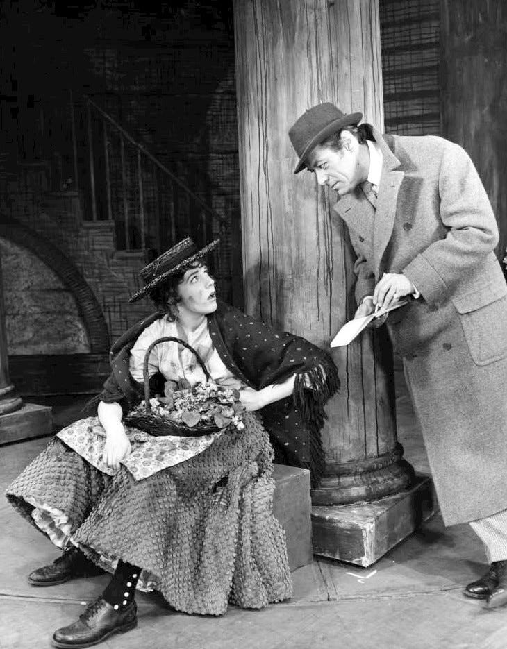 Photo of Julie Andrews and Rex Harrison from My Fair Lady. Eliza Doolittle, the flower girl, meets Professor Henry Higgins. Photo of Julie Andrews and Rex Harrison from My Fair Lady. Eliza Doolittle, the flower girl, meets Professor Henry Higgins.