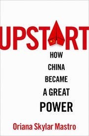 A white and red cover with black text

Description automatically generated