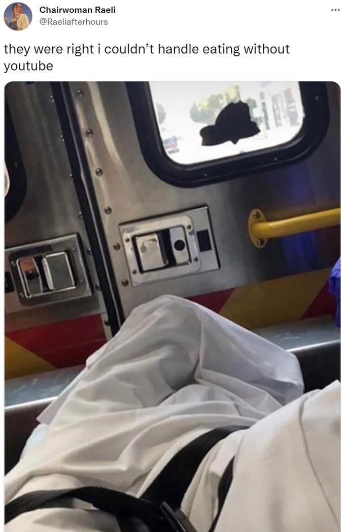 Tweet by @Raeliafterhours: "they were right I couldnt handle eating without youtube". Attached is a first-person POV photo of a stretcher-bound individual in an ambulance.
