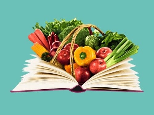 This may contain: an open book with fruits and vegetables in it on top of a blue background,