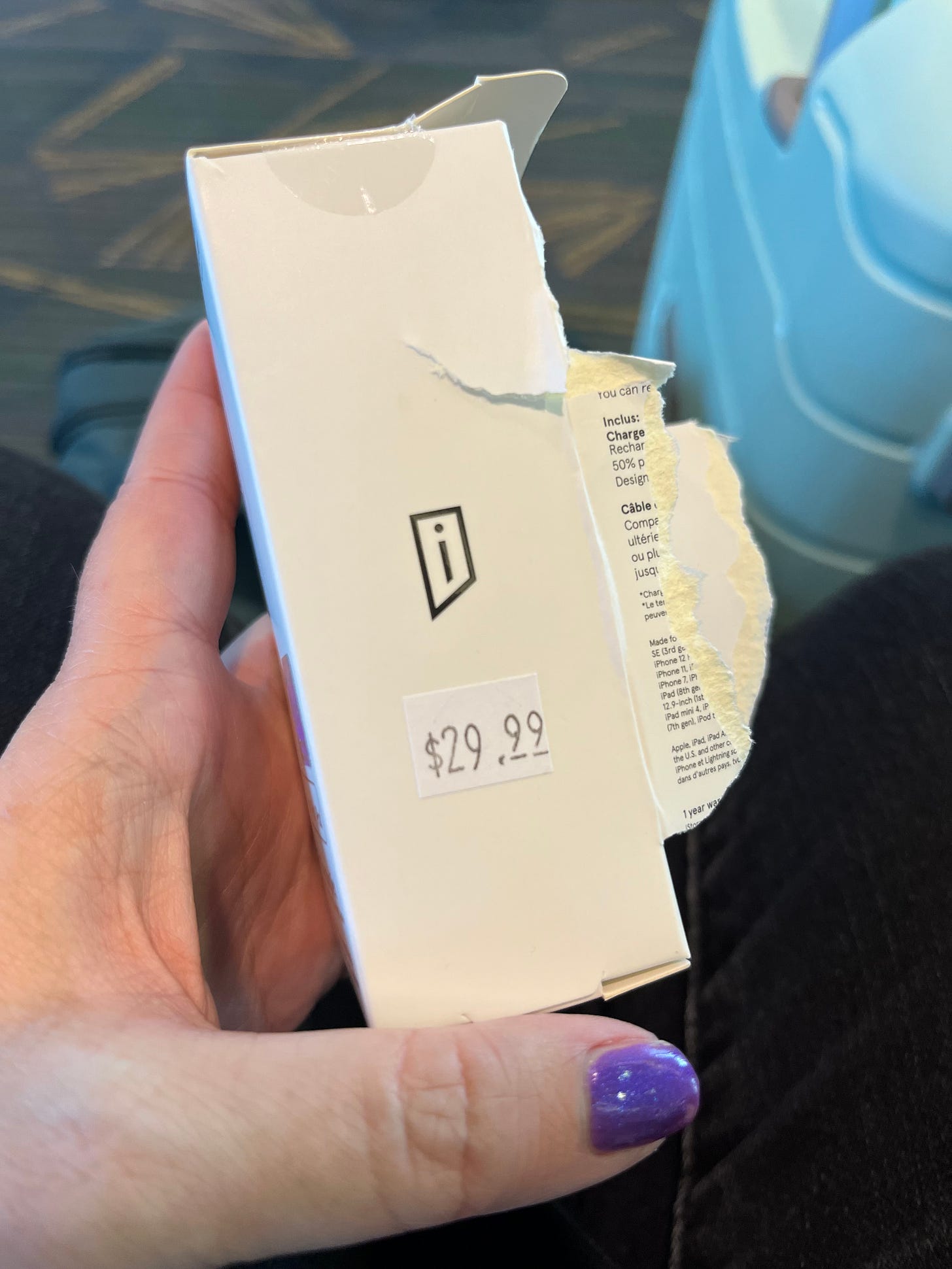 photo of my hand holding up a charger box that says $29.99 photo of my hand holding up a charger box that says $29.99