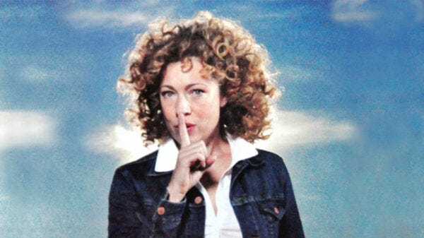 A person with curly hair holding her finger to her mouth

AI-generated content may be incorrect.