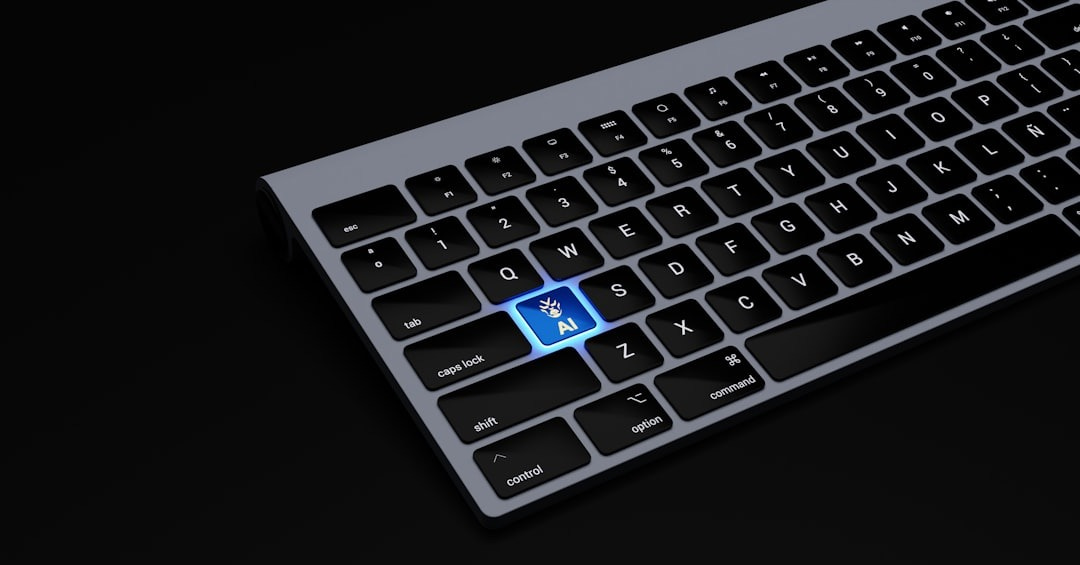 a black keyboard with a blue button on it a black keyboard with a blue button on it