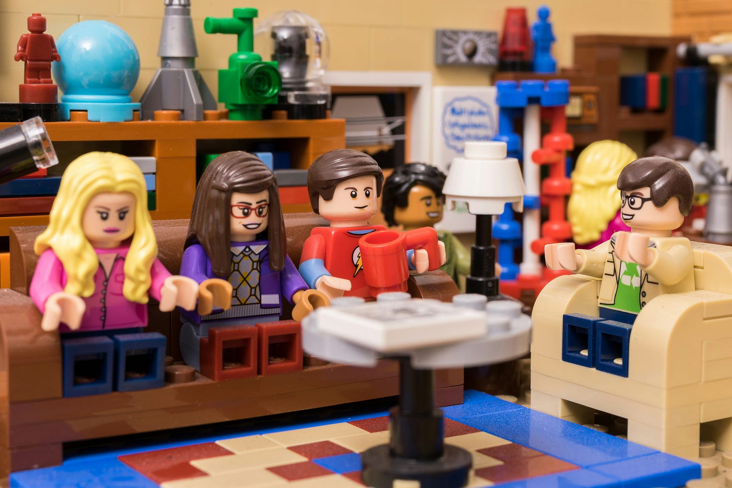 A bunch of Lego People friends sit and chat in their cosy lounge