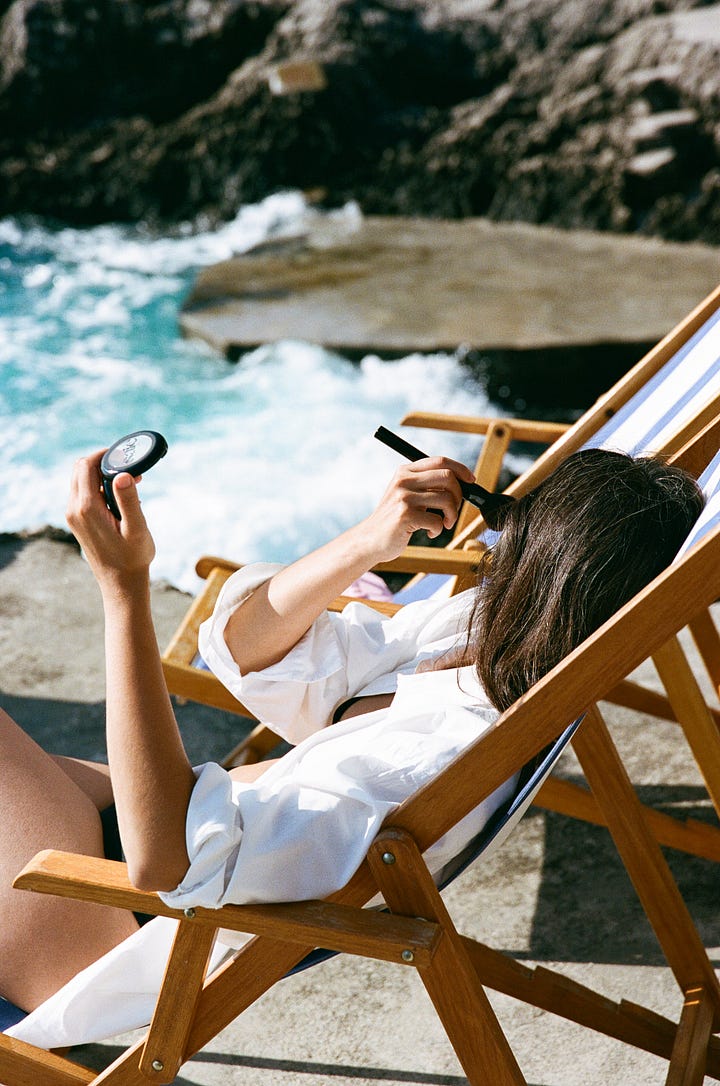 Two images: A terracotta disc and a woman applying blush in a white shirt sitting in a lounge chair by the water.