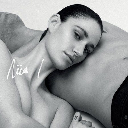 Image may contain Skin Niia Human Person Face and Back