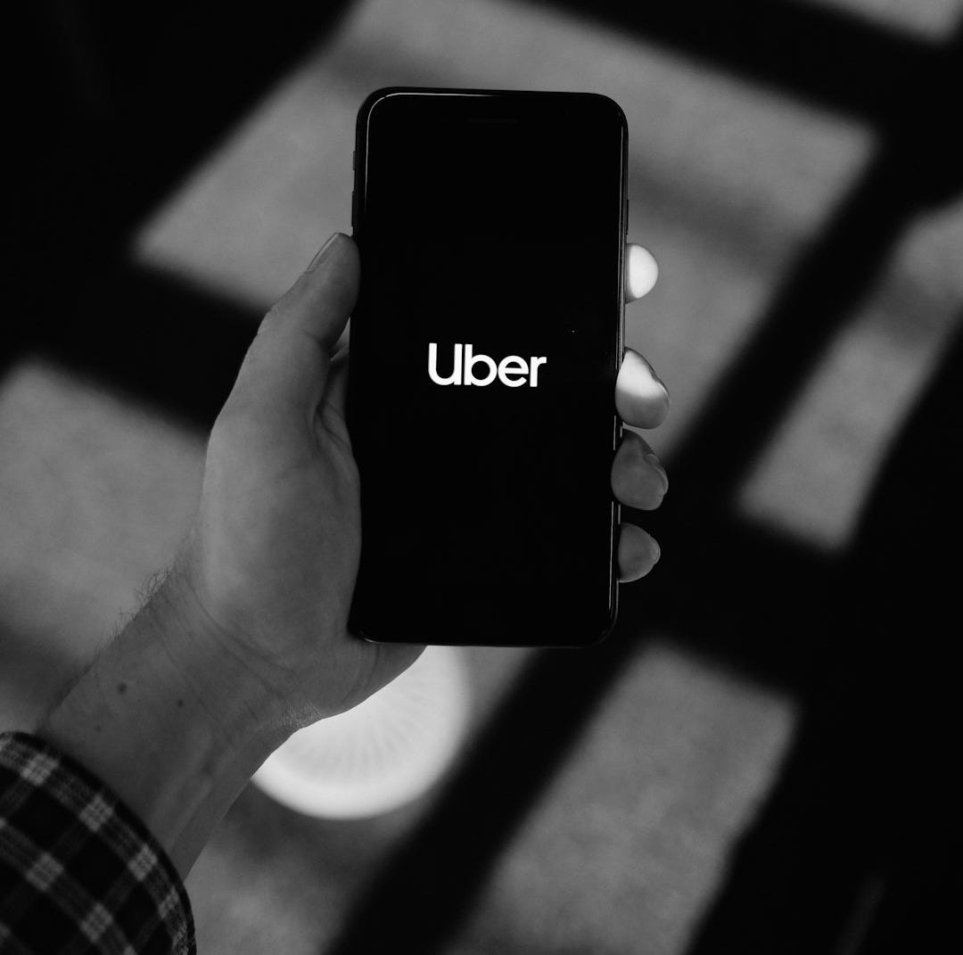 person holding black iphone 5
