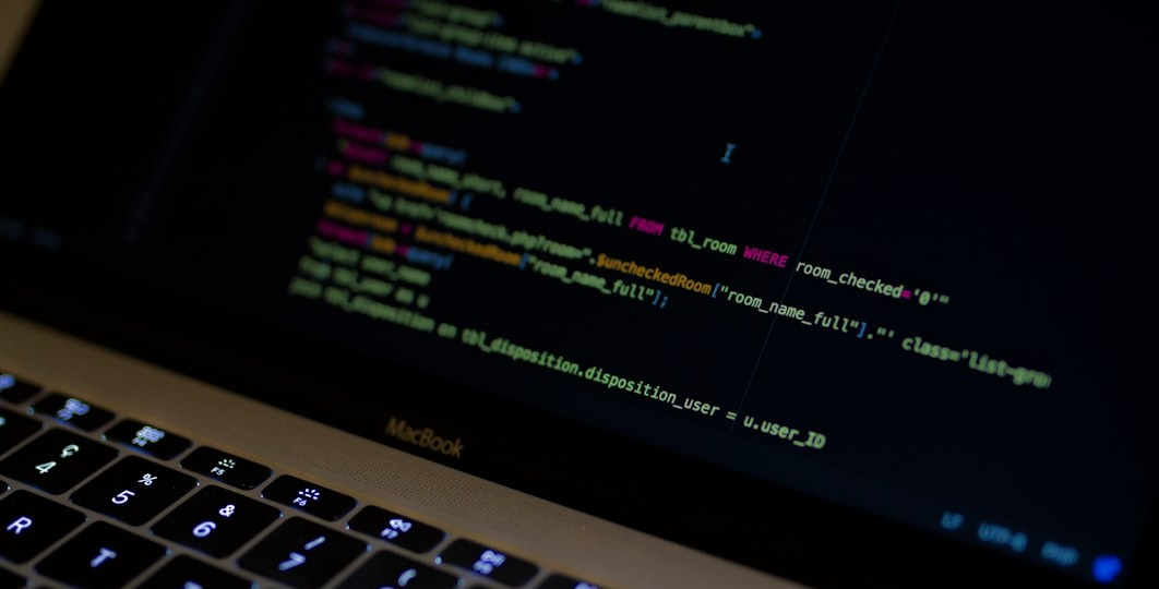 MacBook Pro with images of computer language codes MacBook Pro with images of computer language codes