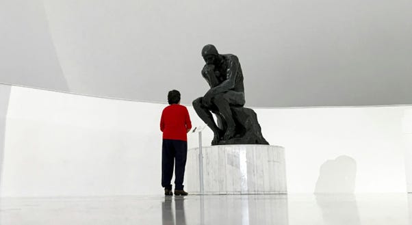 A person looking at a statue

AI-generated content may be incorrect.