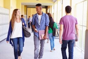Students walking in high school hallway