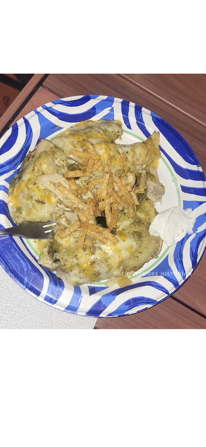 A four-photo sequence of campfire chicken enchiladas: raw ingredients on a picnic table, the assembled pan topped with shredded cheese, the bubbling finished dish, and a final serving on a plate.
