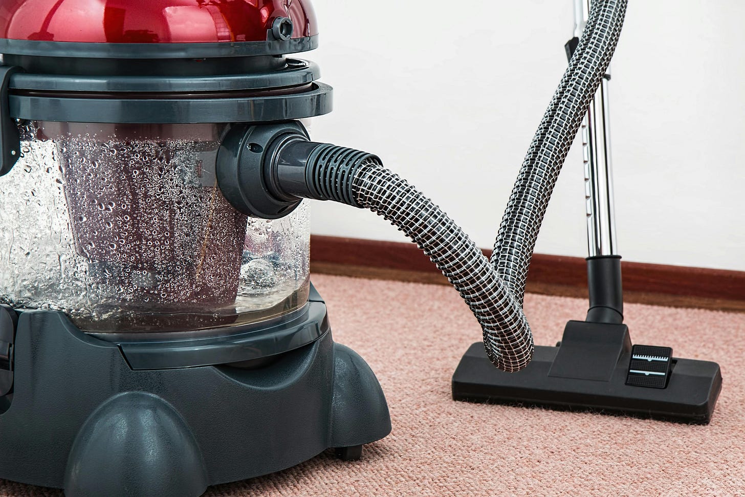 Vacuum cleaner red top black bottom