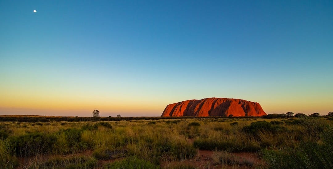 brown lake under blue sky