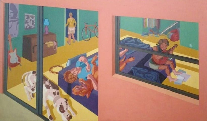 A view through a sliding glass door and window of a pink house with yellow interior floor and green wall containing a mattress on the floor, dogs, people and musical instruments