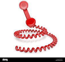 A vintage telephone handset connected ...