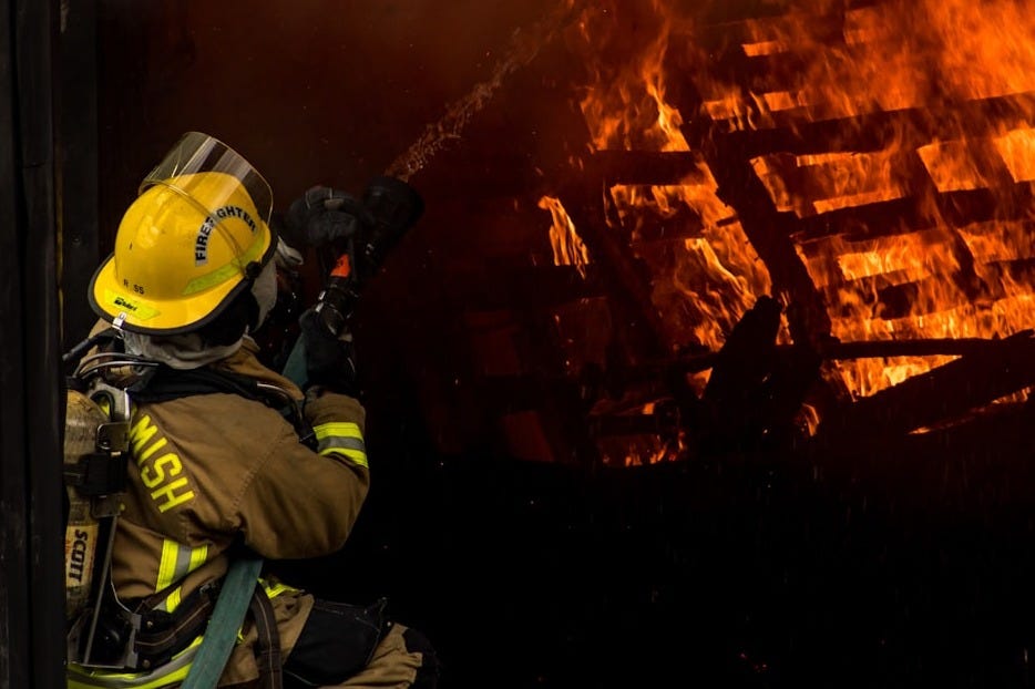 firefighter inside burning house