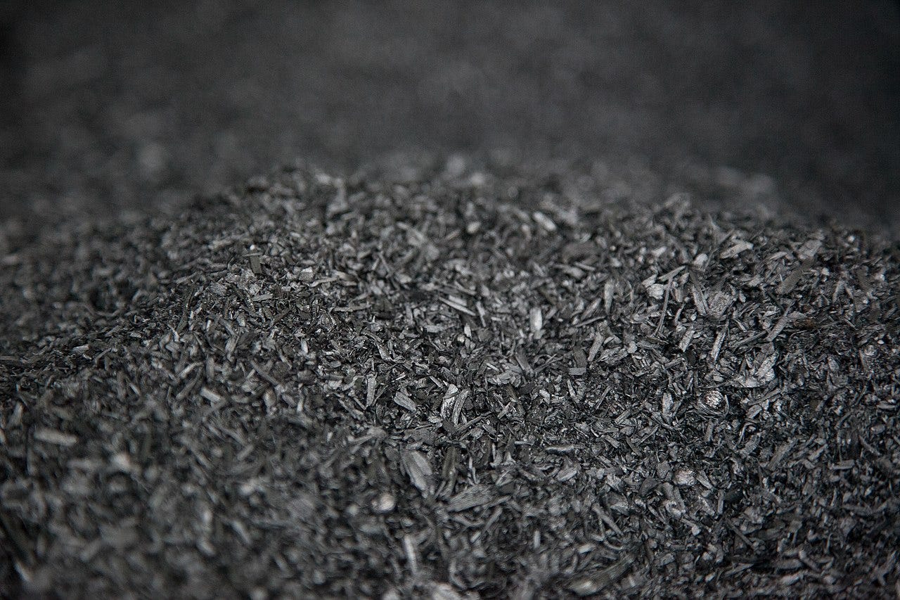 A large pile of biochar A large pile of biochar