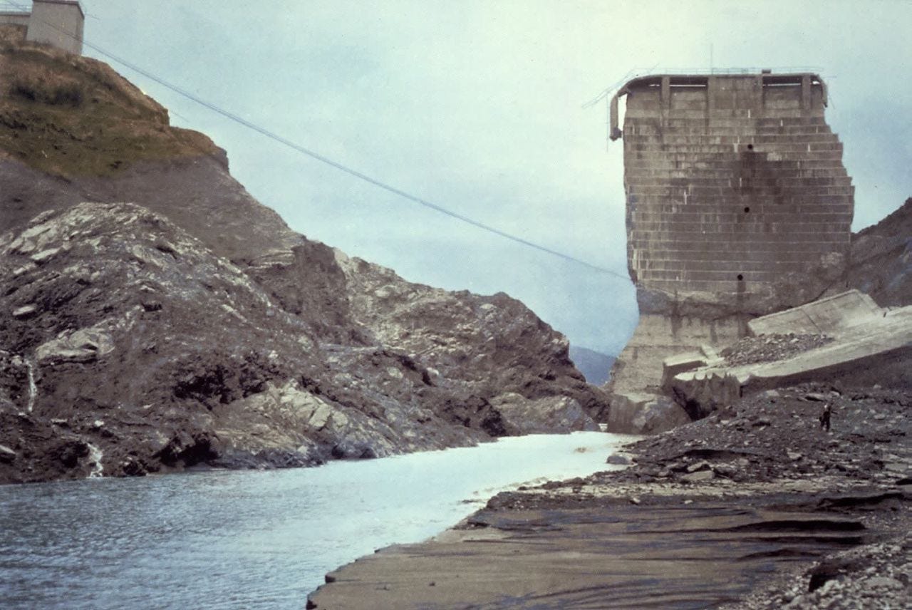 Tall concrete piece left standing next to shore