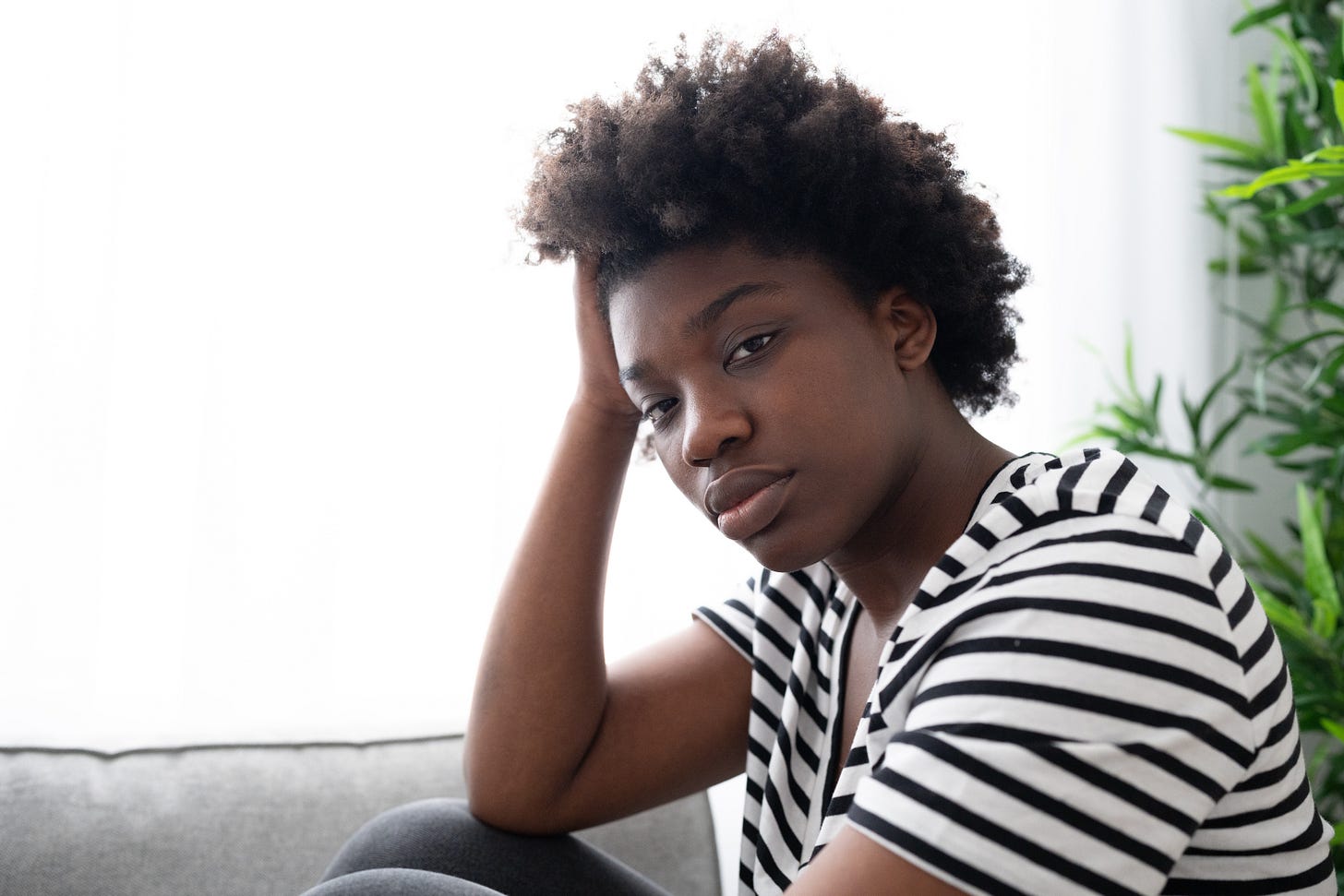 sad serious black woman facing camera