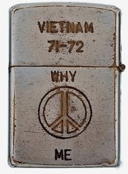 This may contain: a lighter with the word vietnam on it and a peace sign painted on it's side