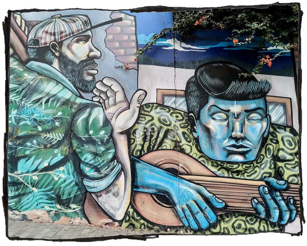 Street art from Lima, Peru depicting two men playing guitars.