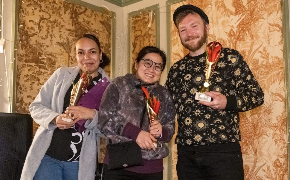 The three Chilli Sauce Competition Winners, left to right: Samantha Baker-Hunter, third place with Spicy Mama sauce, Weng Woo, second place with Woo-tan Clan sauce and Dale Andrews in first place with Mango Tango sauce.