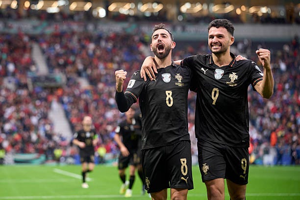 Bruno Fernandes of Portugal celebrates with Goncalo Ramos after scoring his team's sixth goal during the FIFA World Cup 2026 qualifier match between...