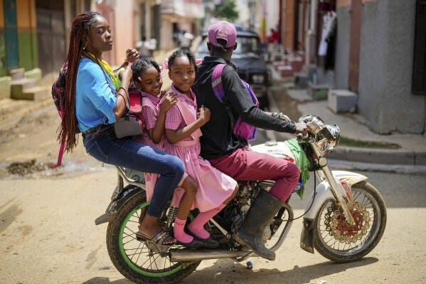 People ride on a motorcycle in Cap-Haitien, Haiti, Wednesday, April 17, 2024. (AP Photo/Ramon Espinosa) People ride on a motorcycle in Cap-Haitien, Haiti, Wednesday, April 17, 2024. (AP Photo/Ramon Espinosa)