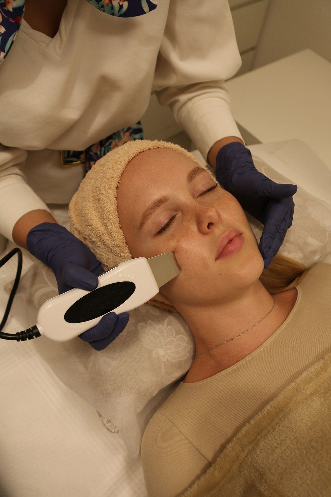 A woman undergoing an aesthetic treatment A woman undergoing an aesthetic treatment