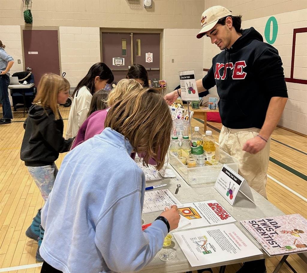 MCS students visiting a table run by a Dartmouth College student MCS students visiting a table run by a Dartmouth College student